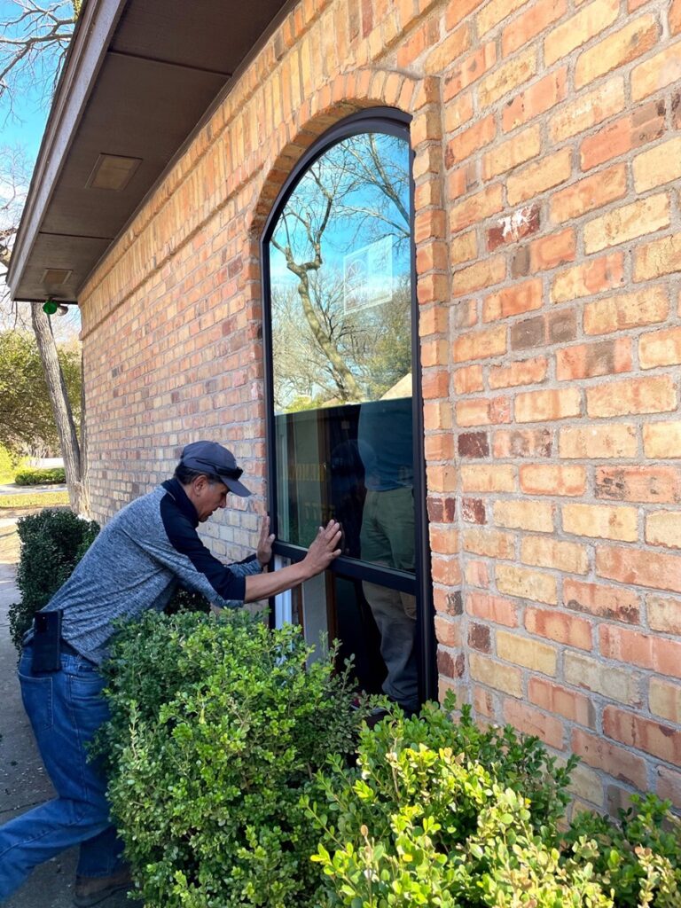 A-man-installing-energy-efficient-replacement-windows-in-Silver-Spring-MD-window-repair
